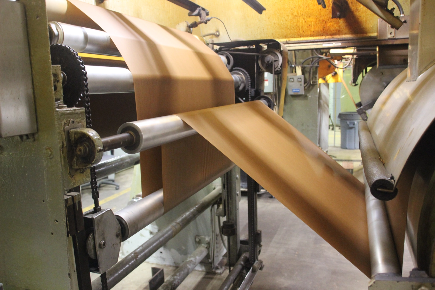 Paper production machine in industrial setting.